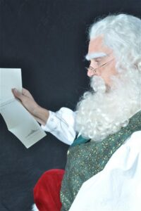 Authentic Santa Claus reading Christmas letter in DFW Texas