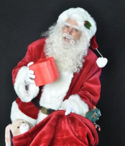 Professional Santa performer with gifts in Dallas Fort Worth Texas