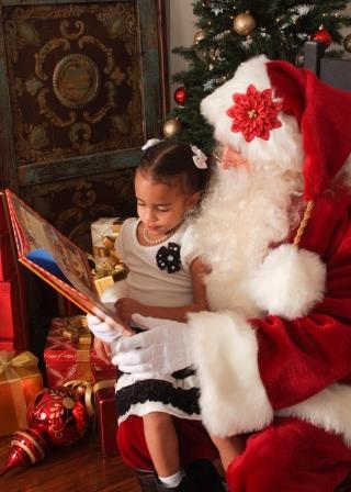 Santa Claus reading storybook to young girl DFW home visit