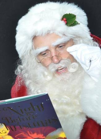 Santa Claus Storytime With Child at Shreveport Louisiana Holiday Event Santa Claus storytime with child at Shreveport Louisiana holiday event